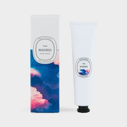 Natural hand cream with violet fragrance from the Madrid Collection. Moisturizing hand cream in a tube with floral packaging design.