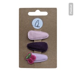  "Three hair clips in cherry red, purple, and pink with textured fabric and decorative embellishments for kids"