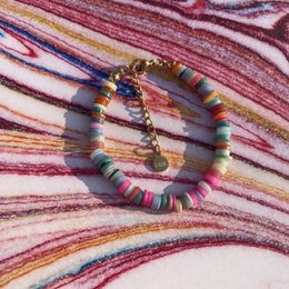 Multicolored shell bead bracelet with a mix of vibrant colors and textures.