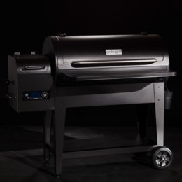 Large black pellet grill with digital controls and storage shelf. Suitable for outdoor barbecuing and smoking.