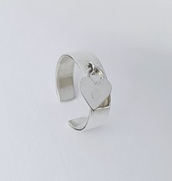  Silver ring with heart-shaped design, available in sizes 50-52, 54-56, and 58-60.