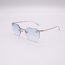 Octagonal-shaped sunglasses in a light blue color with a silver metal frame.