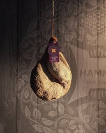Italian cured prosciutto, dark meat, whole leg, artisanal aged salume, premium quality.
