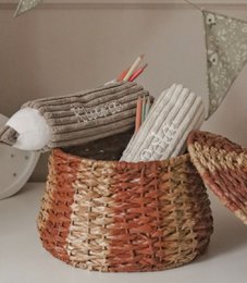  Corduroy pencil case in the shape of a crayon with child's name, made of woven material in brown and white colors.