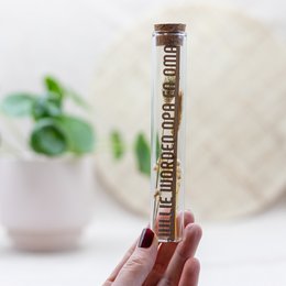 Dried flower tubes with the text "You will be grandpa & grandma" printed on the label. The tubes contain a variety of dried flowers and foliage in warm, earthy tones.