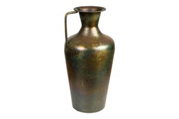  Antique metal jug with a tall, cylindrical shape and a narrow neck. The jug has a bronze-colored finish with a slightly distressed appearance, giving it an aged and rustic aesthetic. The dimensions are 25x25x51cm.