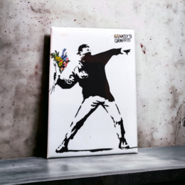 Black and white graffiti-style image of a person throwing flowers, mounted on a rectangular fridge magnet.