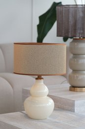  Lamp base with a white glass gourd-shaped body and a wooden base. The lamp has a simple, elegant design suitable for use as a table lamp.