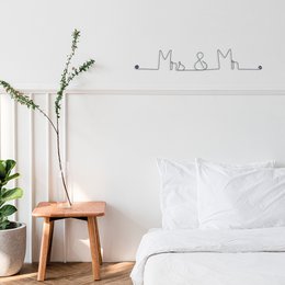 Wall sticker with text "Mrs & Mr" in cursive wire design, suitable for Valentine's Day decor.