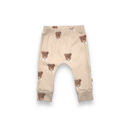 Beige harem pants with a repeating dog print pattern. The pants have an elastic waistband and a loose, relaxed fit.