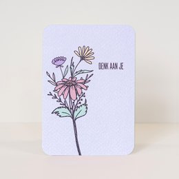 Colorful floral postcard with the text "Denk aan je" (Think of you) and a bouquet of flowers in various shades of pink, purple, and yellow.