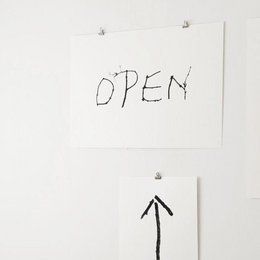 A simple black and white screen print with the word "OPEN" written in a handwritten style, accompanied by an arrow pointing downwards.