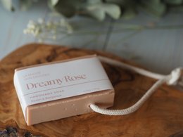 Dreamy Rose soap on a rope, a floral-scented bar soap with a rope for hanging. Made with natural ingredients.