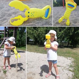 Sand Snapper, recogedor de arena amarillo con diseño de cangrejo