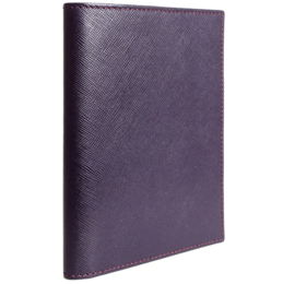 A burgundy-colored leather passport sleeve with a textured saffiano pattern.