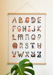 Colorful alphabet poster with animal-themed letters, suitable for a child's room or nursery. The poster features a variety of animals, shapes, and textures that make up the letters, creating an engaging and educational display.