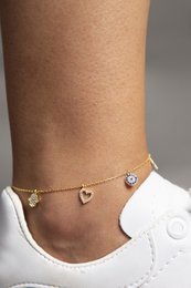 Delicate gold-toned anklet with charms including hearts and a flower-shaped charm. Suitable for casual or dressy wear.