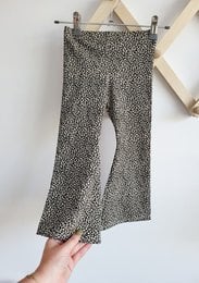 Flared leopard print kids pants in sizes 74/80 to 122/128. Made of a soft, stretchy material with a flared leg design.