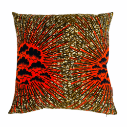 A round, red and gold patterned cushion with a textured, abstract design.