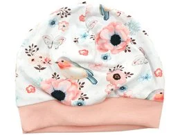 A soft, cozy baby hat featuring a delicate floral and bird print in shades of white, pink, and blue. The hat has a comfortable stretch fit and is perfect for keeping little ones warm and stylish.