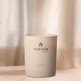 Scented glass candle with a minimalist design and nature-inspired scents. Available in variants like "Nature's Best" and "There's No Planet B". The candle has a simple, cylindrical shape and is made of glass.