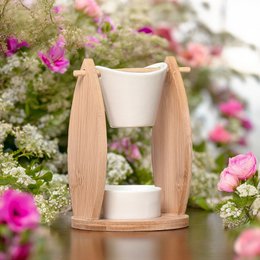 Ceramic and bamboo oil burner with melting and scented waxes for home fragrance and gift ideas.