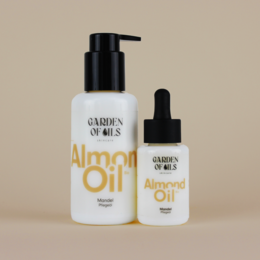 Organic almond oil in 100ml bottle, suitable for face, body, and hair care. Contains natural ingredients for nourishing and moisturizing skin.