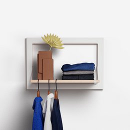  White wall-mounted clothes rail with shelves for storage and hanging clothes. Made of wood with a minimalist, modern design.