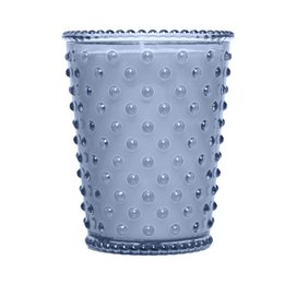 A tall, round glass candle in a chestnut color with a hobnail texture and pattern. The candle has a rustic, vintage-inspired design.