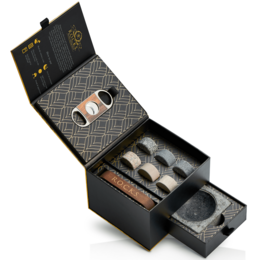 A sophisticated cigar set with a sleek black box, cigar cutters, and cigar holders. The set includes accessories for the discerning cigar aficionado.