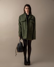 Olive green utility jacket with multiple pockets, suitable for women's outerwear.