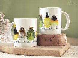  Ceramic mug with colorful Asian bird design, suitable for use as a decorative or functional item.