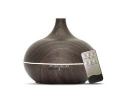 Dark wood aroma diffuser with remote control for essential oil mist, light, and timer functions.