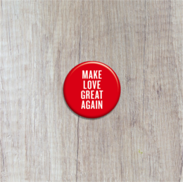 Round red button with white text "Make Love Great Again"