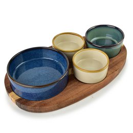  Modern kitchen serving board with four bowls in blue, cream, and green ceramic on wooden base.