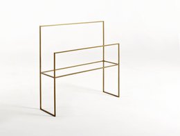 A modern, minimalist bathroom hanger in black, white, or gold metal finish. Features a simple, geometric design with multiple bars for hanging towels, robes, or other bathroom accessories.