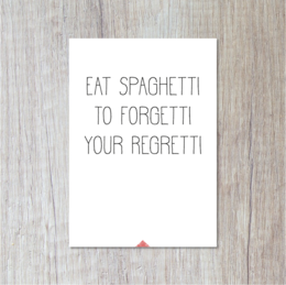 Postcard with text "Eat spaghetti to forget your regrets" on a wooden background.