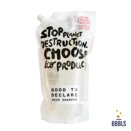  A 1100ml bottle of Good to Declare shampoo, featuring a white and red label with the text "Stop Planet Destruction. Choose Eco-Produc" and "Good to Declare" printed on it.