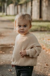 Beige knit sweater for babies, available in sizes 3-6 months to 4 years. Made of soft, warm material perfect for cooler weather.

meta_keywords: baby sweater, knit sweater, beige sweater, baby clothing, toddler clothing