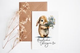 Vintage-style Easter greeting card with an illustration of a rabbit holding a bouquet of flowers. The card has a brown kraft paper background with floral accents.