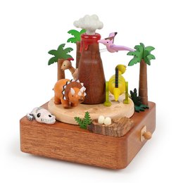 Wooden music box with volcano and dinosaur figurines, featuring a tropical scene with palm trees and a volcano. The music box plays a soothing melody.