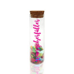  A tall, cylindrical glass container with a cork lid, filled with colorful confetti. The container is labeled "WUNSCHERFULLENLER" in neon pink text.