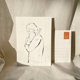 A postcard featuring a sketch of a pregnant woman, likely a gift for a mother-to-be.