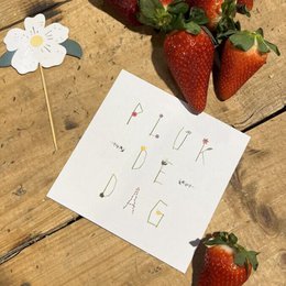  "Thank you card with floral design and strawberries"

The image shows a thank you card with a handwritten message "Thank you" on it. The card is placed on a wooden surface, surrounded by fresh strawberries and a white flower. The overall design and composition suggest this is a thank you card, likely for a special occasion or event.