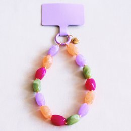 Stainless steel earrings with heart-shaped charms in pink and gold colors.