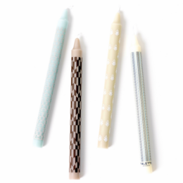 Set of 4 retro-style dinner candles in various colors and patterns, including solid colors, stripes, and a textured design.