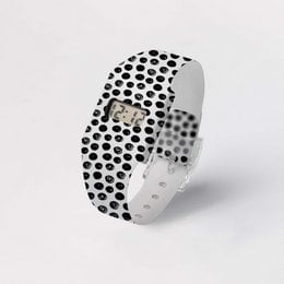 A digital wristwatch made of Tyvek® with a black and white polka dot pattern. The watch has a minimalist, modern design.
