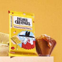 Salted caramel chocolate bar with a whimsical character on the packaging. The product is a snack bar made of chocolate with a salted caramel filling.