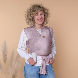 Soft, cozy swaddle blanket in a light pink and white striped pattern. Made of breathable, stretchy material for a comfortable wrap.