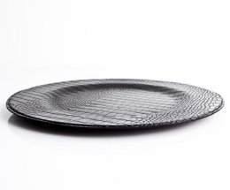 Zwart krokodil rond bord